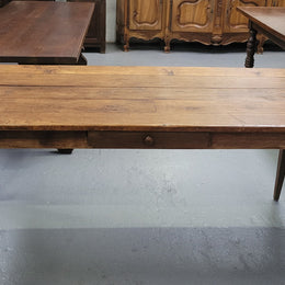 Provincial 19th Century French Oak rustic farmhouse table with tapered leg and single drawer. It has been sourced from France and is in good original detailed condition. 