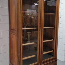 Stunning French Henry II style Walnut two door bookcase. In good original detailed condition.