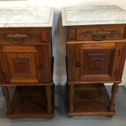 Pair of French Oak Arts and Crafts bedsides cabinets with lovely Carrara marble top and drawer and cupboard for storage. In good original detailed condition.