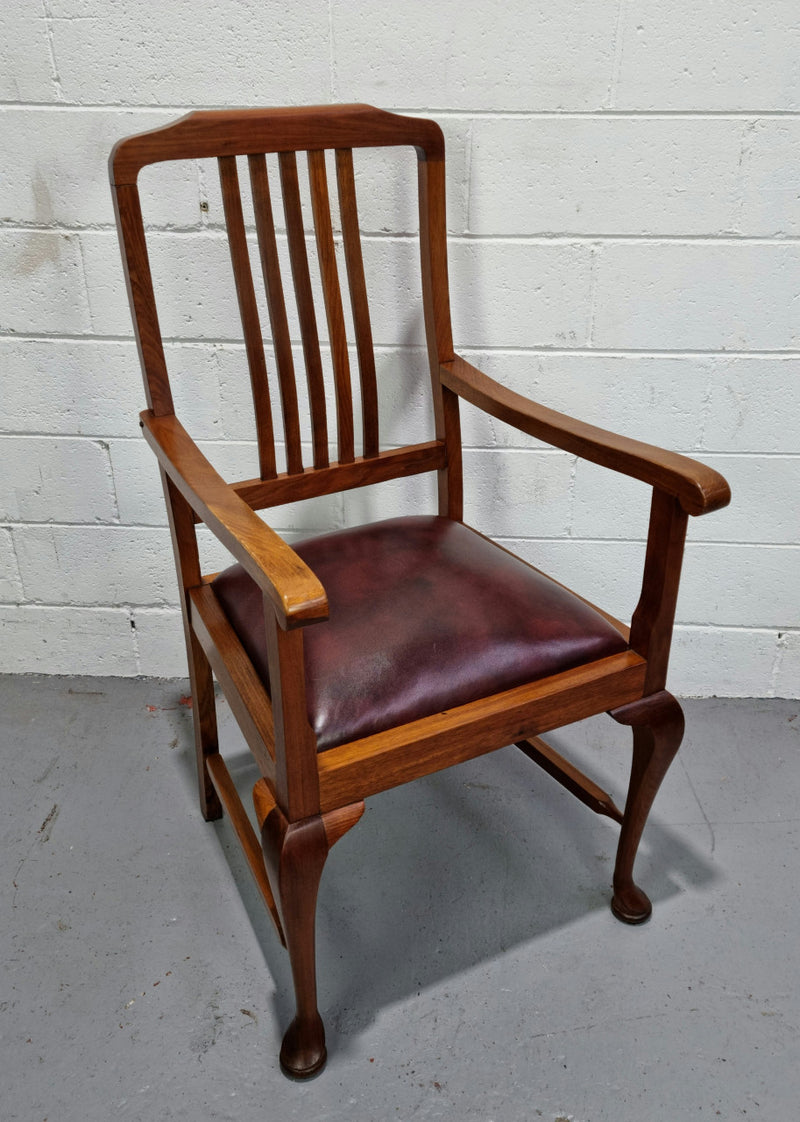 A very comfortable Black Wood Period leather seat armchair. In leather and chair are in good original condition.