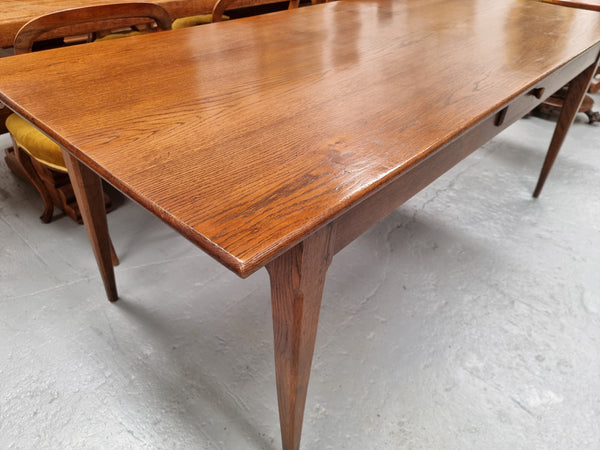 Antique French Oak Farmhouse table in fully restored condition. Features a single drawer and tapered legs.