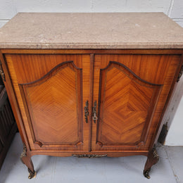 Stunning compact Louis 15th style two door walnut cabinet with ormolu trim and marble top. It is in good original condition.