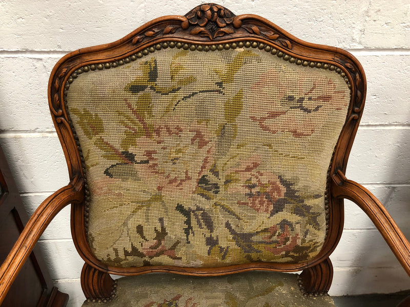 Pair of French Walnut Tapestry covered armchairs. They are in good original detailed condition. Slight wear and tear to fabric but still in good condition please view photos.