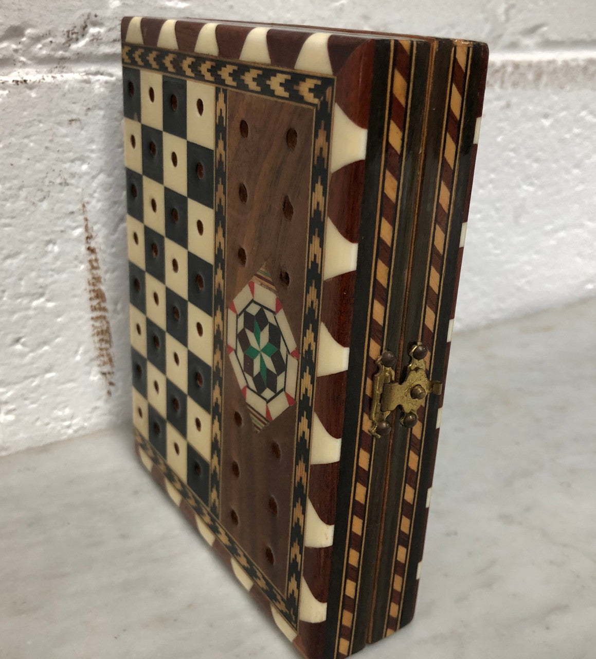 Vintage inlaid folded chess board box with pieces inside. In good clean original condition.