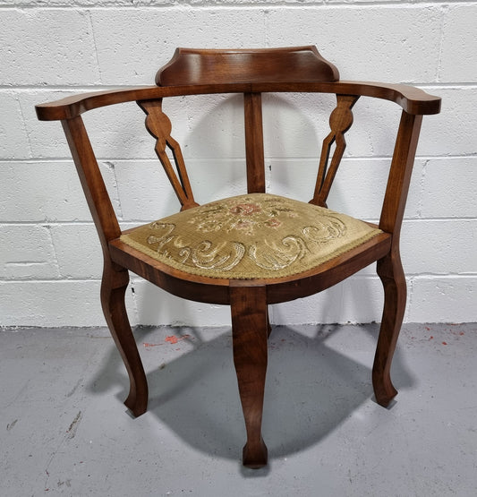 Mahogany upsholstered corner chair. It is in good original condition with clean upholstery.