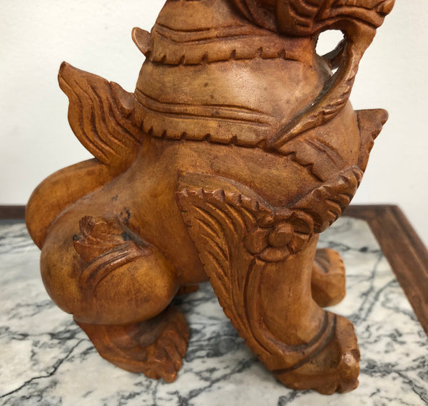 Chinese carved Teak Foo dog with very good detail. In good original condition.