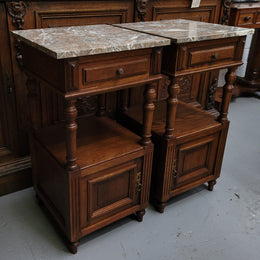 Pair of French Antique Oak marble top bedsides Henry II style. They have a drawer, cupboard and an open shelf for all your storage needs. They have been sourced from France and are in good original detailed condition.