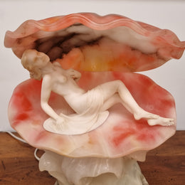 A superb original hand carved Art Deco lamp. Alabaster and marble sculpture of a nude woman inside a clam shell. Italian, inscription to base. Circa 1920's. Subtle colouring to clam shell for a sunset effect. This is a world class example of a true Art Deco sculpture lamp. It is in good original detailed condition, please view photos as they help form part of the description.