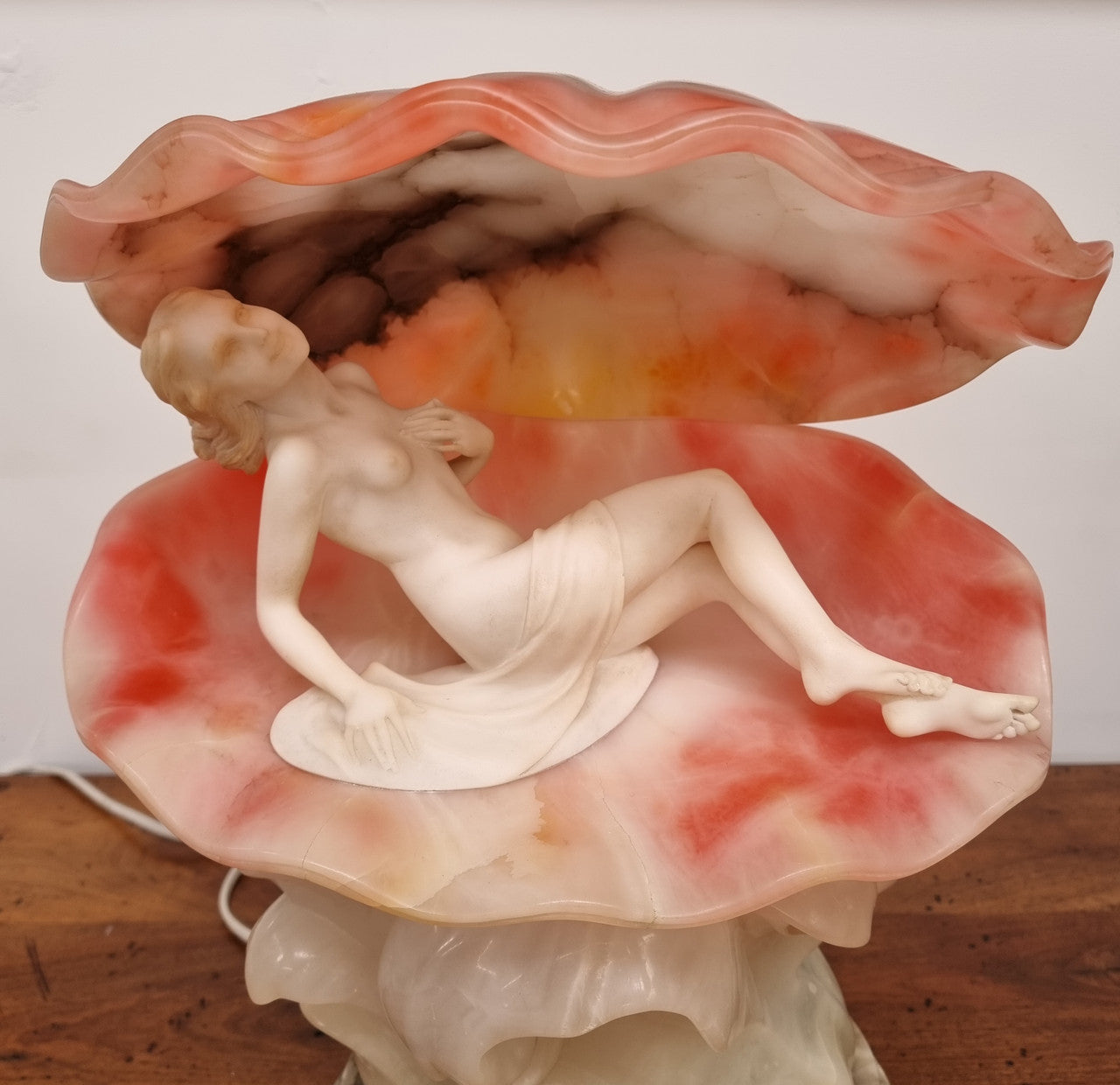 A superb original hand carved Art Deco lamp. Alabaster and marble sculpture of a nude woman inside a clam shell. Italian, inscription to base. Circa 1920's. Subtle colouring to clam shell for a sunset effect. This is a world class example of a true Art Deco sculpture lamp. It is in good original detailed condition, please view photos as they help form part of the description.