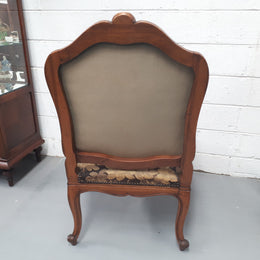 Pair of 19th Century French walnut tapestry covered arm chairs. They are in good original condition. Circa 1890.