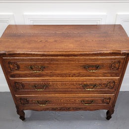 French Louis XV style Oak three drawer chest with wooden top. It has been sourced from France and is in good original detailed condition.