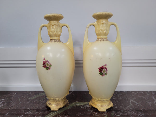 A beautiful pair of Edwardian Austrian hand-painted vases depicting a decorative flower scene. They are in good original condition with no chips or cracks. Please view photos as they help form part of the description.