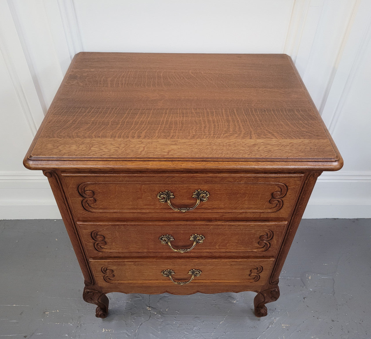 French Oak Louis XV style side drawers with lovely handles and three drawers. It has been sourced from France and is in good original detailed condition.