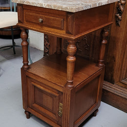 Pair of French Antique Oak marble top bedsides Henry II style. They have a drawer, cupboard and an open shelf for all your storage needs. They have been sourced from France and are in good original detailed condition.
