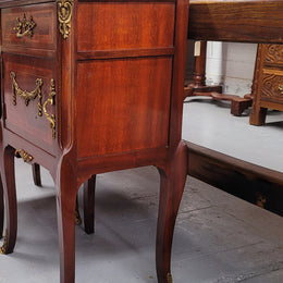 Appealing Louis XV style high quality bedside cabinets with black Portoro marble top and bronze mounts. They have been sourced from France and are in good original condition.