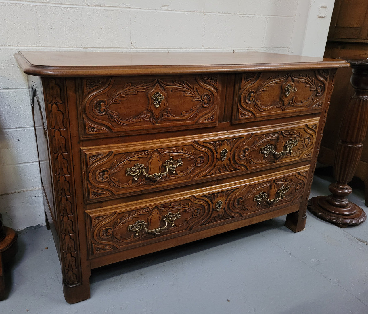 French Cherrywood Louis XIV style wooden topped chest of four drawers. It has been sourced from France and is in good original detailed condition.