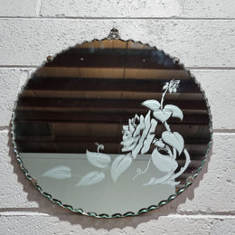 Vintage Art Deco round wall mirror with pie crust edge and etched floral design . In good condition, please see photos .