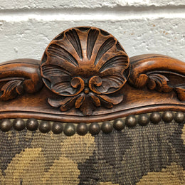 Pair of 19th Century French walnut tapestry covered arm chairs. They are in good original condition. Circa 1890.