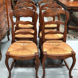 Antique Set of Six French Oak rush seat dining chairs. They are in good original condition and are very strong.