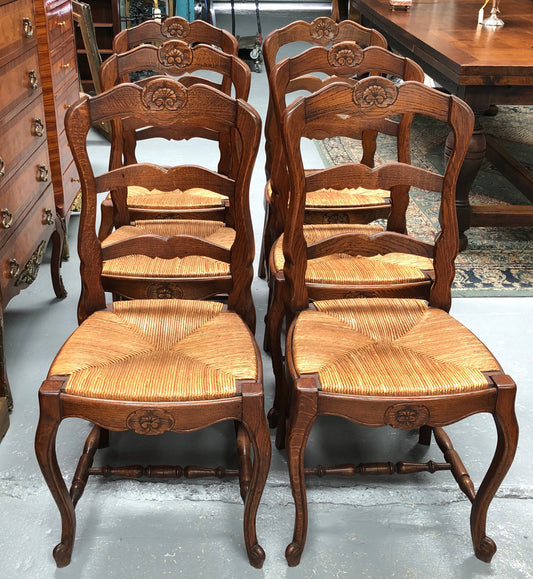 Antique Set of Six French Oak rush seat dining chairs. They are in good original condition and are very strong.