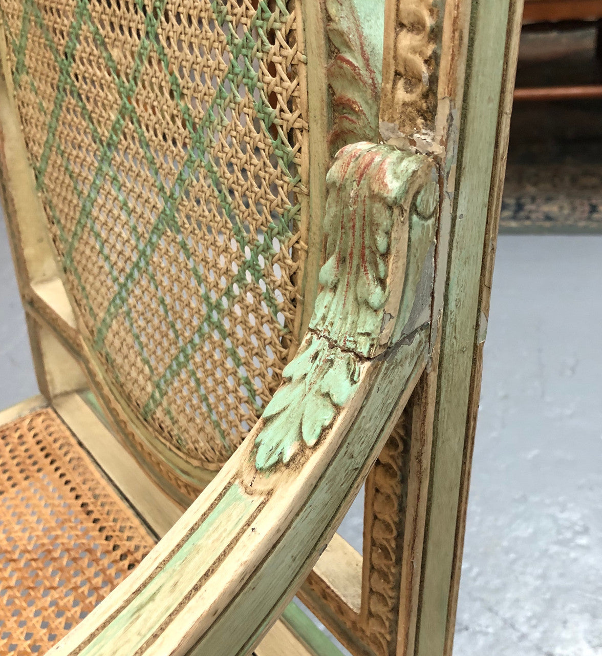 Painted French Louis XVI style cane panel arm chair. Paint is original and it is in very good original condition.