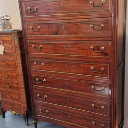 Absolutely beautiful French Empire seven drawer semainier with a lovely white carrara marble top and amazing bronze handles. It has its original key and is in good original detailed condition.
