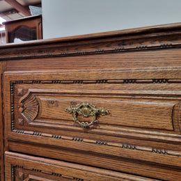 Early 19th Century French Oak chest of three drawers. It has beautiful handles and carvings. It is in good original detailed condition.