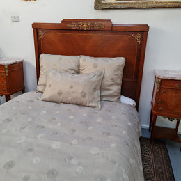 A high quality French Louis XV style bow fronted Queen size bed with marquetry inlay and ormolu mounts. In good original detailed condition. Circa: 1920