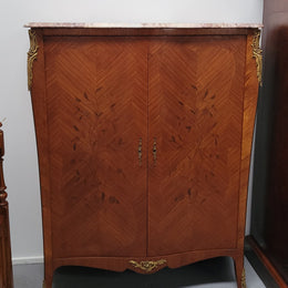 French Louis 15th style Kingwood marquetry inlaid two door cupboard with a beautiful marble top. It has three adjustable shelves and decorative ormolu trim. It has been sourced from France and is in good original detailed condition.