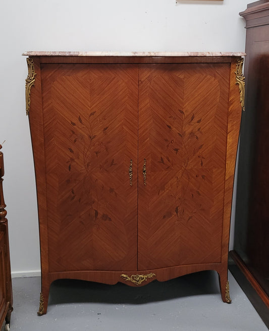 French Louis 15th style Kingwood marquetry inlaid two door cupboard with a beautiful marble top. It has three adjustable shelves and decorative ormolu trim. It has been sourced from France and is in good original detailed condition.