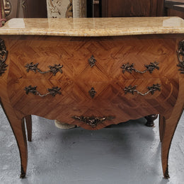 An elegant French Louis XV style kingwood two drawer commode with beautiful decorative inlay and ormolu mounts. Stunning coloured marble top and is in good original detailed condition.