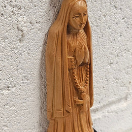 Vintage Olivewood statue of praying Virgin Mary on dark wooden plinth. Condition comensurate with age, please view photos as they help form part of the description.