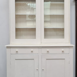 Australian painted two door kitchen hutch display and buffet cabinet. The top section has hooks and shelves. The bottom has two drawers along with cupboard space for added storage. In good original condition.