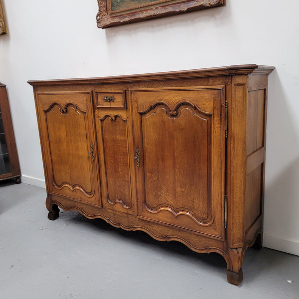 Amazing French Oak early 19th Century two door sideboard with one drawer and two fixed shelves. Sourced from France and in good original detailed condition.
