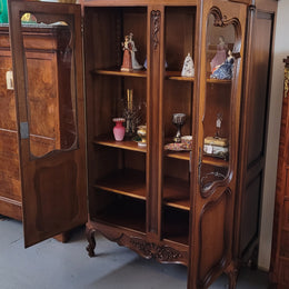 French Walnut Louis XV Style two half glass, door bookcase with three adjustable shelves. Sourced from France and in good original detailed condition.