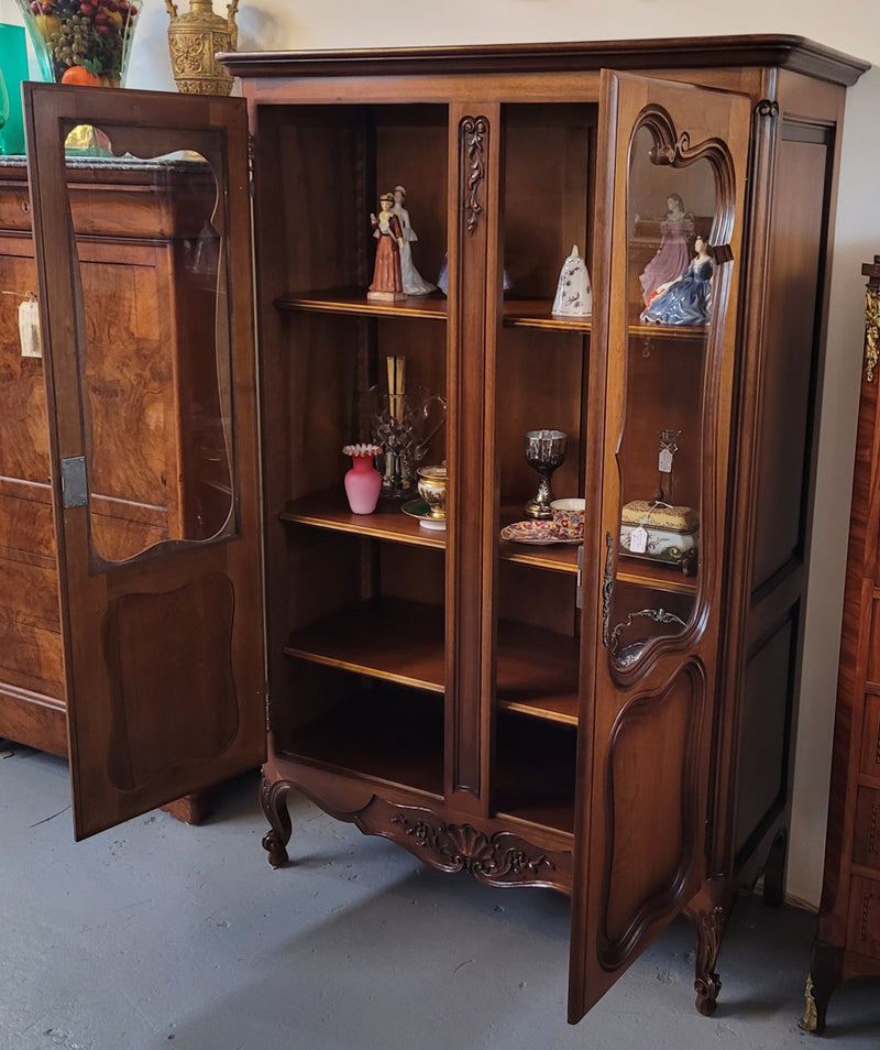 French Walnut Louis XV Style two half glass, door bookcase with three adjustable shelves. Sourced from France and in good original detailed condition.