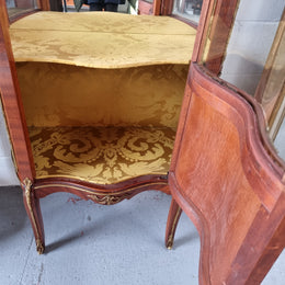 Lovely Vintage French Louis XVth style Vitrine. It has lovely gilt mount details and two glass shelves with room also for storage in good original condition.