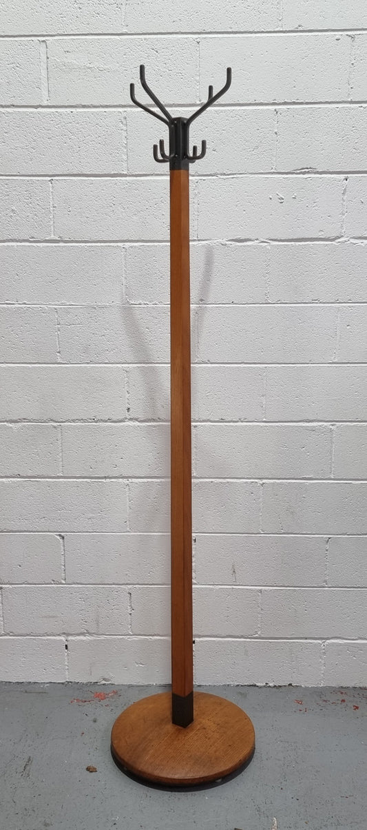 Very sturdy Industrial Queensland maple coat stand on a circular solid base. In good original condition.