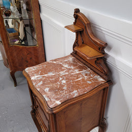 French Louis XV style Walnut single bedside cupboard with inset marble top. It has been sourced from France and is in good original detailed condition.