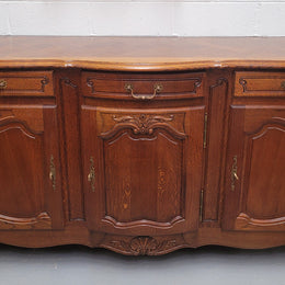 French Oak Louis XV style three drawer three door parquetry top sideboard. It has been sourced from France and is in good original detailed condition.