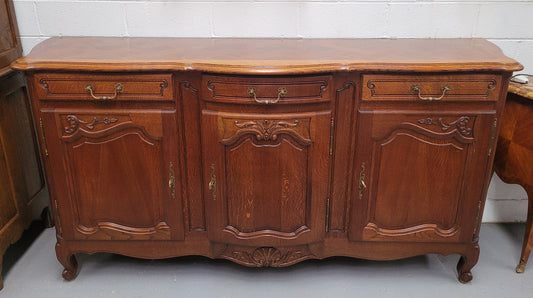 French Oak Louis XV style three drawer three door parquetry top sideboard. It has been sourced from France and is in good original detailed condition.