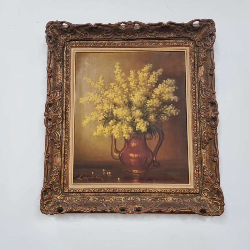 French floral still life painting oil on canvas of Wattle in a vase in a stunning decorative frame in good condition. Signed by artist and has been sourced from France.
