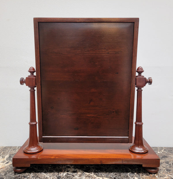 Antique Mahogany dressing table mirror. The mirror is still in good condition and tilts back and forward. It is in overall good original condition. Please view photos as they help form part of the description.