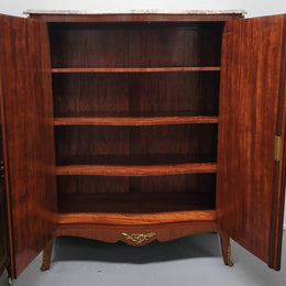 French Louis 15th style Kingwood marquetry inlaid two door cupboard with a beautiful marble top. It has three adjustable shelves and decorative ormolu trim. It has been sourced from France and is in good original detailed condition.