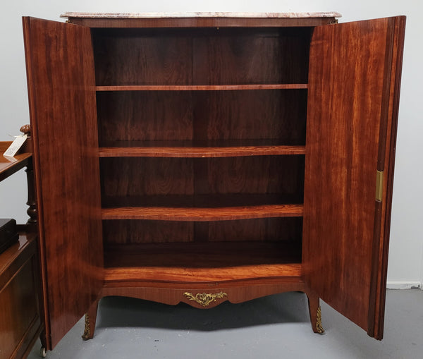 French Louis 15th style Kingwood marquetry inlaid two door cupboard with a beautiful marble top. It has three adjustable shelves and decorative ormolu trim. It has been sourced from France and is in good original detailed condition.