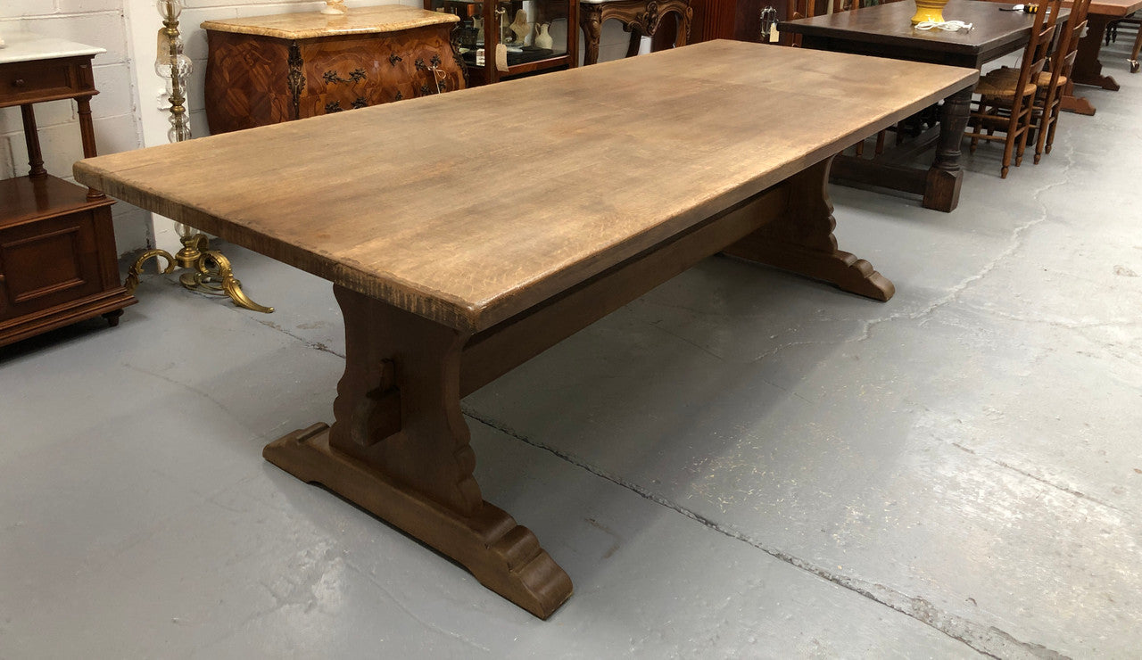 Lovely long French light oak Farmhouse table with a good thick plank top and beautiful stretcher base. Can seat 12 people very comfortable and is in good original condition.