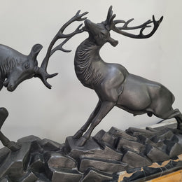 French Art Deco bronzed spelter and marble"Fighting Stags" statue by renowned artist and sculptor "Irenee Rochard".