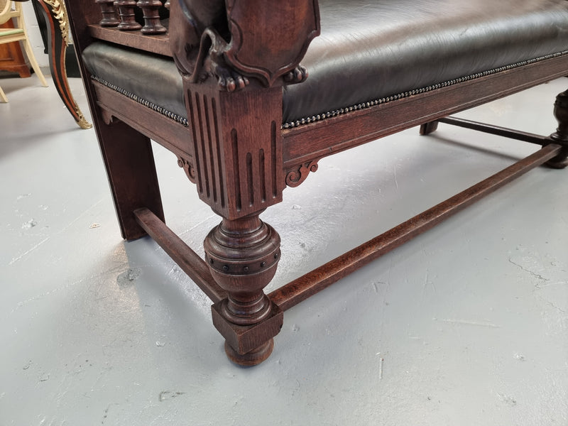 Superbly carved early 19th century newly upholstered French Oak hall seat of grand proportions and lovely details in good condition.