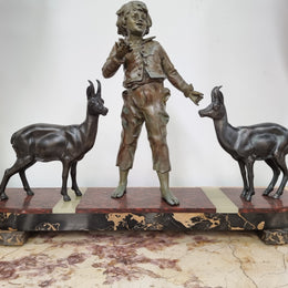 French Art Deco spelter and marble statue of a boy and two deers in good original condition.