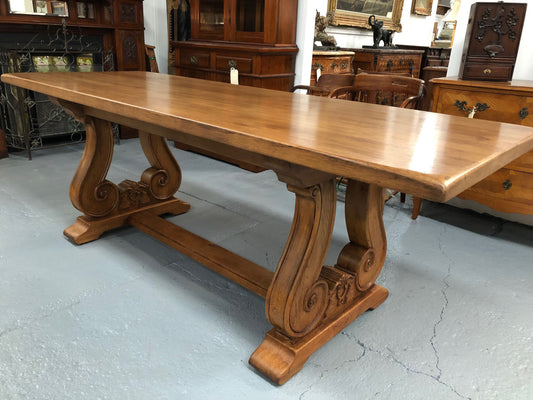 French oak fixed farmhouse table with a charming harp-shaped base. In good original condition and can seat 6-8 people. Circa 1930.